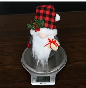 Detailed view of a Christmas gnome doll weight measurement on a kitchen scale