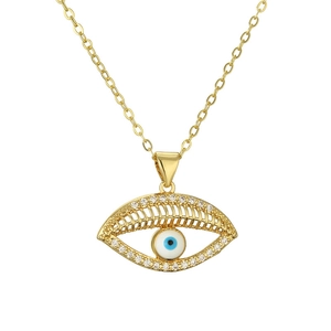 Detailed view of gold Evil Eye necklace with clear crystal pavé setting on white background