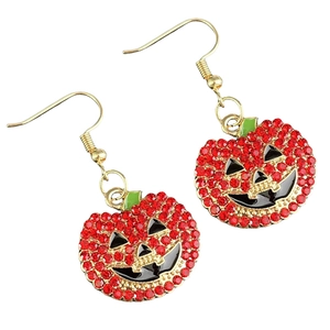 Detail of Halloween pumpkin earrings featuring red rhinestones and golden metal hooks