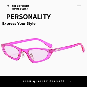 Close-up of pink transparent cat-eye sunglasses frames with metallic stud accents