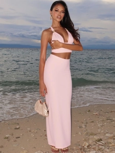 Pink halter-neck crop top and maxi skirt two-piece set for summer beach vacation