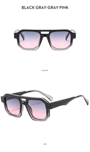 Modern double bridge aviator sunglasses with black frames and gray-pink gradient lenses