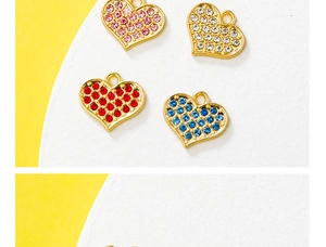 Detail view of heart-shaped pendants with colorful rhinestones in pink, white, red, and blue
