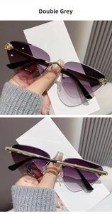 Detail of rimless cat-eye sunglasses with golden cheetah accent and double grey lenses