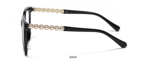 Detail of black sunglasses frame featuring eight white pearls on metal temples