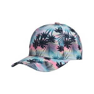 Detail of the tropical palm leaf print on a vibrant gradient baseball cap