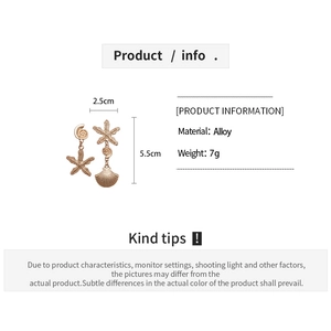 Detail view of gold starfish and shell earrings showing precise size measurements and alloy specs