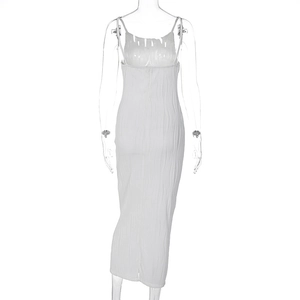 Close-up of white pleated fabric texture on a slim fit sleeveless midi dress