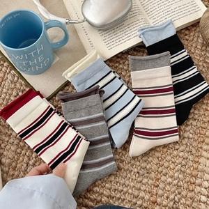 Five pairs of striped cotton crew socks in assorted colors with ribbed cuffs for daily wear