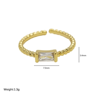 18k gold plated brass birthstone ring with twisted band and clear rectangular gem