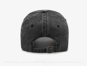 Close-up of dark grey washed denim baseball cap back with bronze adjustable metal buckle