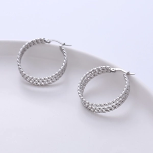 Silver twisted rope hoop earrings in polished stainless steel for a minimalist look