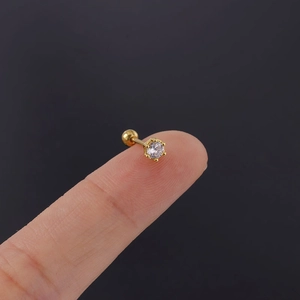 Detail of 20G stainless steel earring with 3mm cubic zirconia showing size on finger