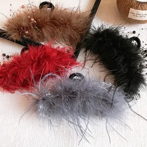 Elegant feather hair claws with pearl accents in four colors for stylish updo hair styling