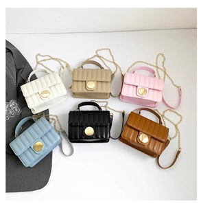 High-angle view of quilted square bags in six colors with gold chain straps and metal buckles
