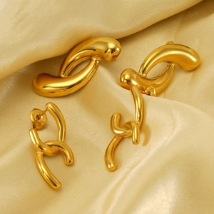 Close-up of minimalist 18k gold plated stainless steel irregular geometric earrings