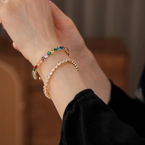Detail view of luxury zircon heart bracelets in colorful and white stones with gold plating