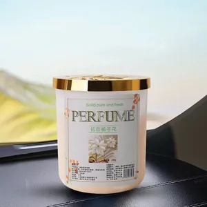 Gardenia car air freshener balm in 190g frosted bottle with gold lid on dashboard