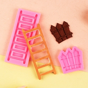 Detailed pink silicone molds for ladder and fence shapes with realistic wood texture