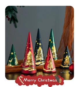 Close-up of glass cone Christmas lights with gold reindeer and tree patterns
