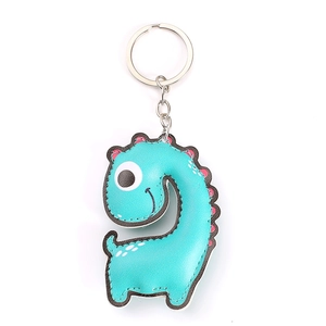 Detail of teal leather dinosaur keychain with pink dots and sturdy metal keyring