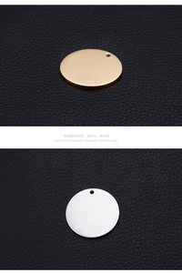 Close-up of polished gold and silver stainless steel round disc charms for DIY jewelry
