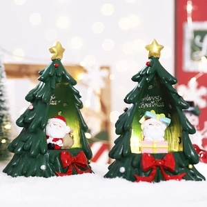 Resin Christmas tree figurine with Santa Claus model and warm LED lights for home decor