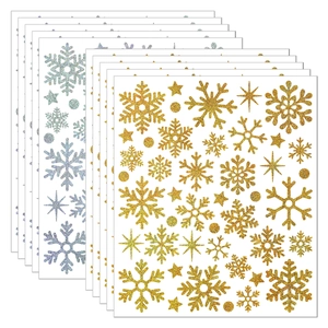 Detailed view of glittering gold and silver Christmas snowflake stickers for holiday crafts