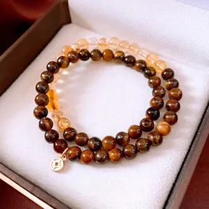 Set di bracciali con perle di occhio di tigre e citrino e ciondolo a moneta dorata
