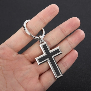 Polished stainless steel cross keychain with black carbon fiber inlay and sturdy metal ring