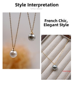 Dettaglio di perle tonde da 12mm bianche e grigie su eleganti catene in oro 18 carati