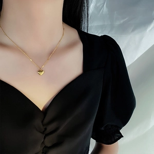 Minimalist gold heart pendant necklace for women worn on neck for luxury look