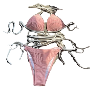 Two-piece dusty pink textured bikini with white drawstrings and metallic ring details