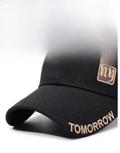 Detail of embroidered TOMORROW lettering and ny patch on black canvas baseball cap