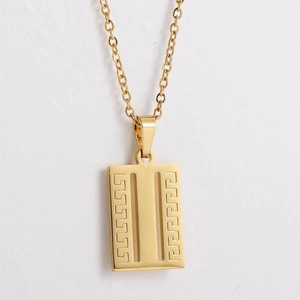 Close-up of golden titanium necklace featuring a rectangular pendant with Greek key pattern