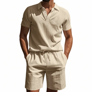 Detail of men's beige linen set showing texture of short sleeve polo and drawstring shorts