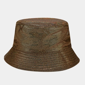 Close-up of bronze sequined fabric texture on a reversible bucket hat with metallic finish