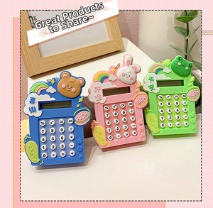 Detailed view of mini cartoon calculators in blue, pink and green with charm ring