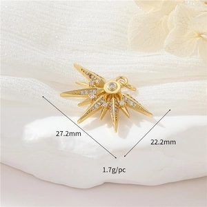 Detail showing a 27.2mm gold starburst pendant with zircons and product specifications