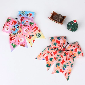 Close-up of grosgrain ribbon bows with Christmas prints including Santa and snowman
