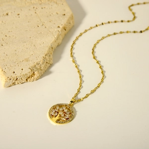 Golden tree of life pendant necklace with sparkling marquise and round cubic zirconia