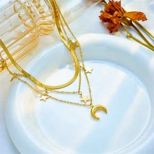 Three-layer titanium steel necklace with star and moon charms on a minimalist gold chain