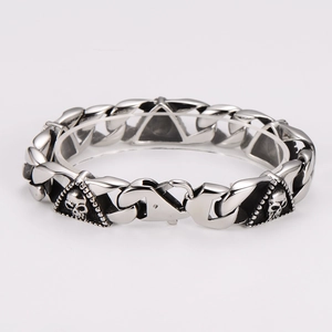 Retro punk silver skull bracelet with chunky triangle link chain on white background
