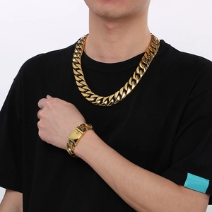 Men's gold Cuban link chain necklace and bracelet set in polished stainless steel