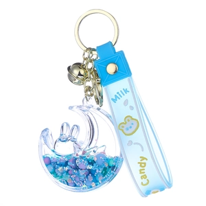 Blue moon liquid sand keychain with rabbit model and silicone strap on white background
