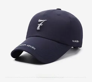 Detail view of navy baseball cap featuring 3D embroidered number 7 and side lettering