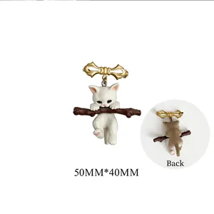 Cute white cat on branch brooch with gold bow, including back view and 50x40mm size detail