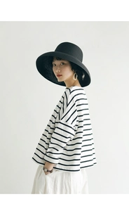 Detail of classic black and white striped long-sleeve T-shirt with a relaxed loose fit
