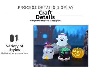 Close-up of Halloween glowing ghost figurines with pumpkin and cauldron miniature set