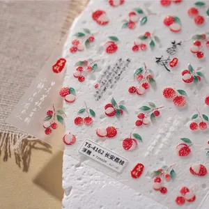 Detailed 3D embossed nail stickers featuring red lychee patterns and Chinese motifs